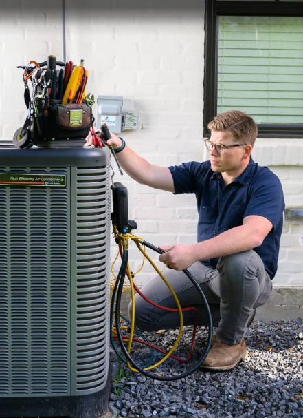 HVAC technician diagnosing